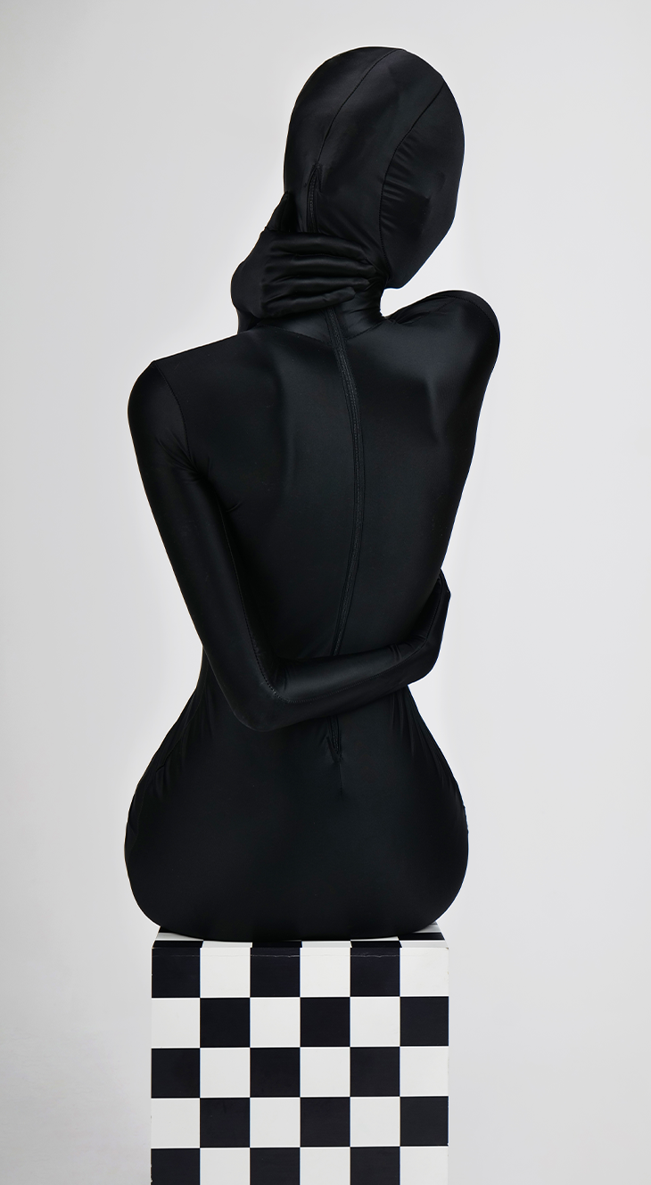 Dark glossy full catsuit zentai by InTheMask by MOLIS, featuring a high-shine finish and sleek, form-fitting design.
