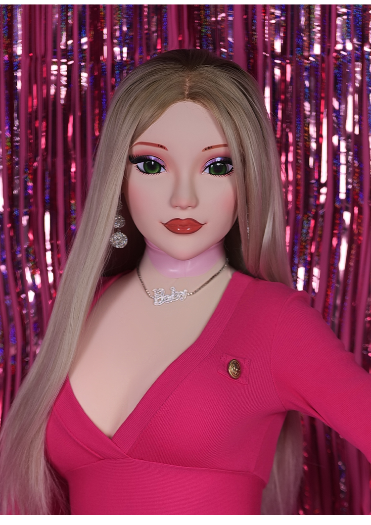 InTheMask by MOLIS Barbie doll mask with latex hood and gag, featuring detailed black and pink design, close-up view.