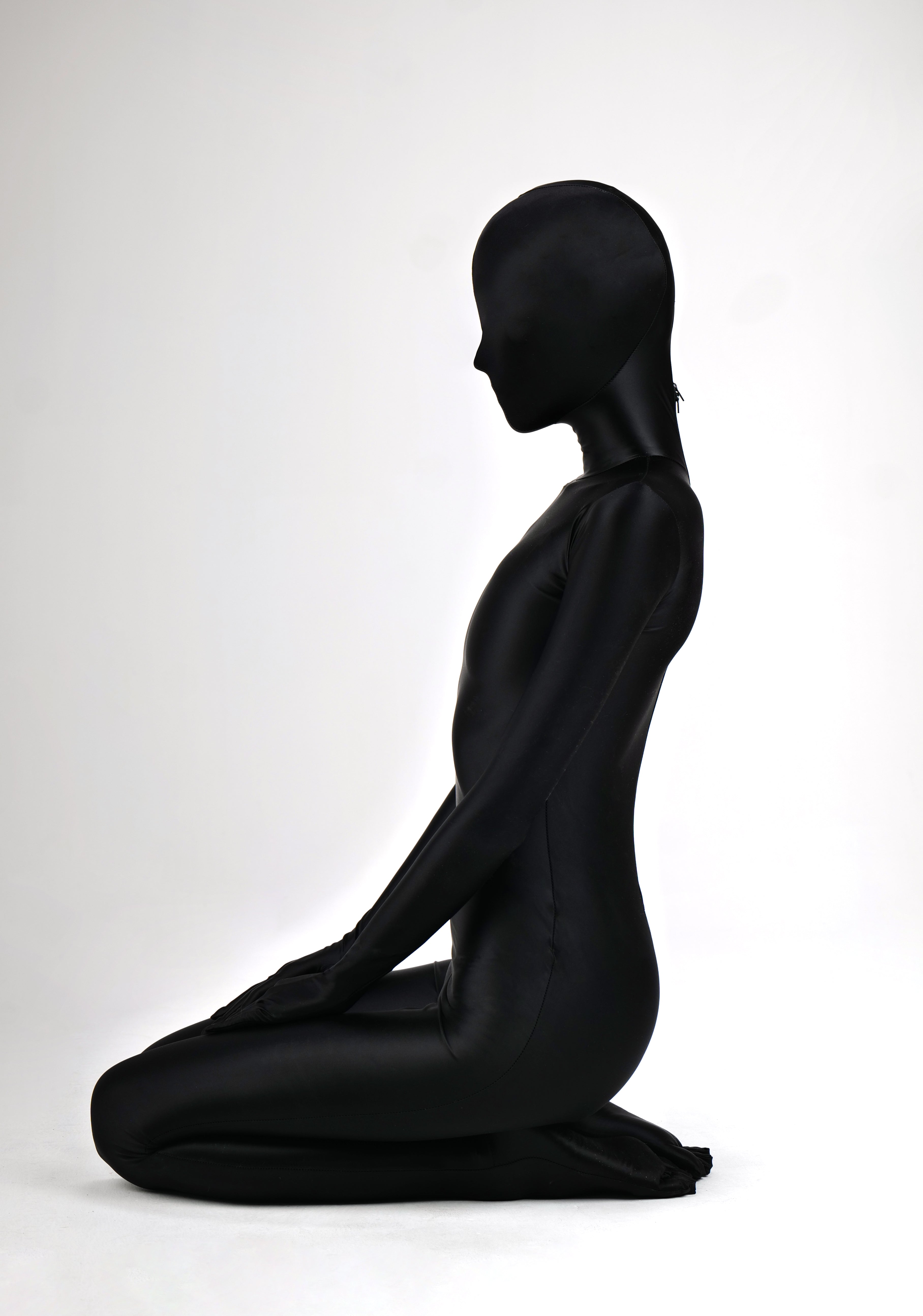 Dark glossy high-shine full catsuit zentai by Molis Zentai, featuring a sleek, form-fitting design in a smooth, reflective material.