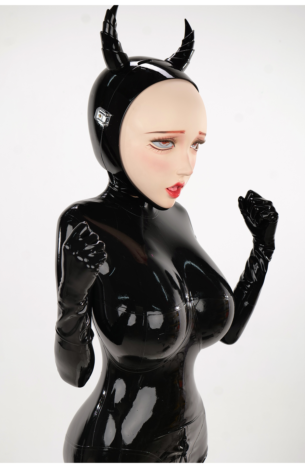 InTheMask by MOLIS NEOGAN Disguiser black mask with two ponytails and padlocks, featuring detailed design and textured surface.
