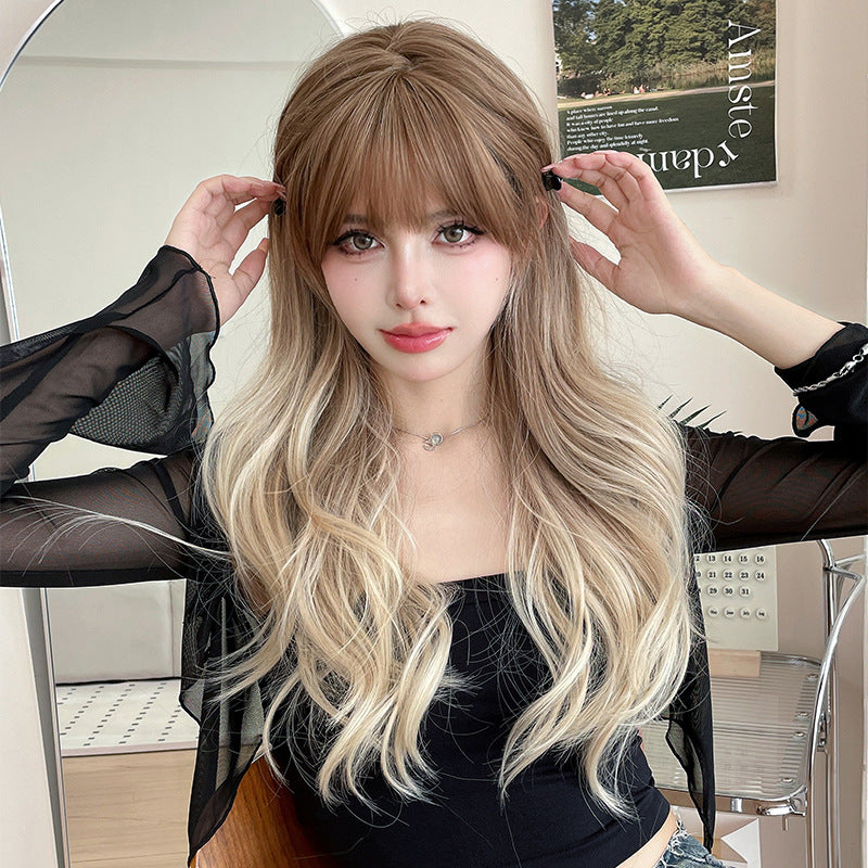 Long curly flaxen light brown wig by InTheMask, 67cm with gradient color, showcasing voluminous, wavy hair style.