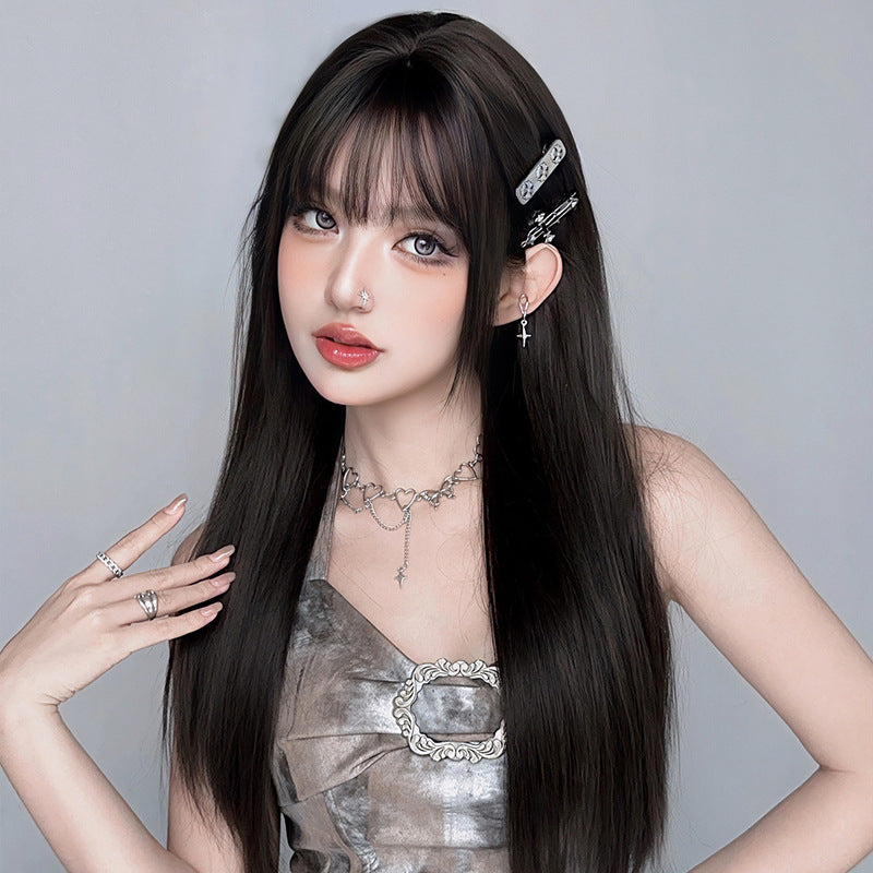 Long straight black wig with full black tea color, 73cm, from InTheMask by MOLIS, displayed on a mannequin head.