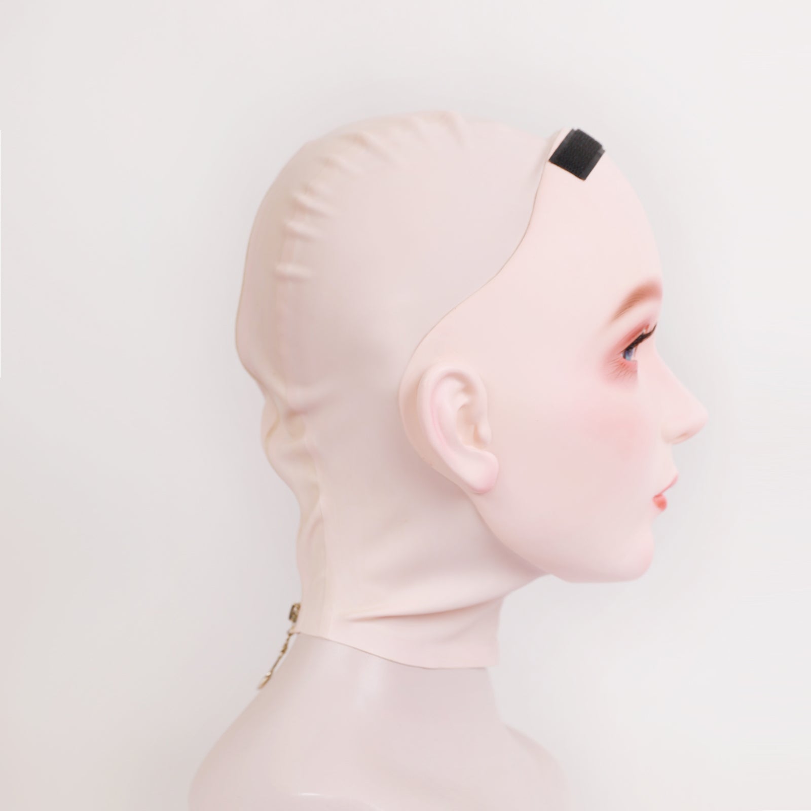Furgie female doll mask by InTheMask with latex hood, optional mouth gag, nude latex, 0.4mm thickness, for adult costume or role-play