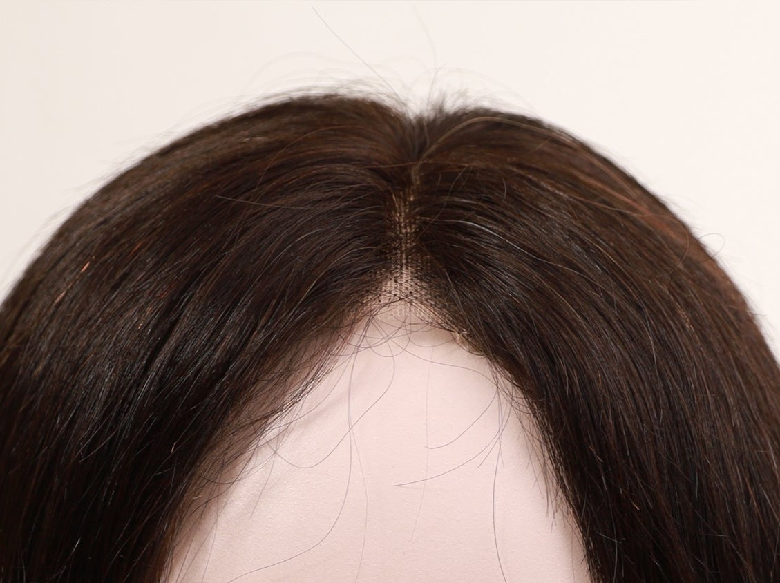 Genuine full lace wig in brunette brown, 16-22 inches, by InTheMask by MOLIS, showcasing long, wavy hair on a mannequin head.