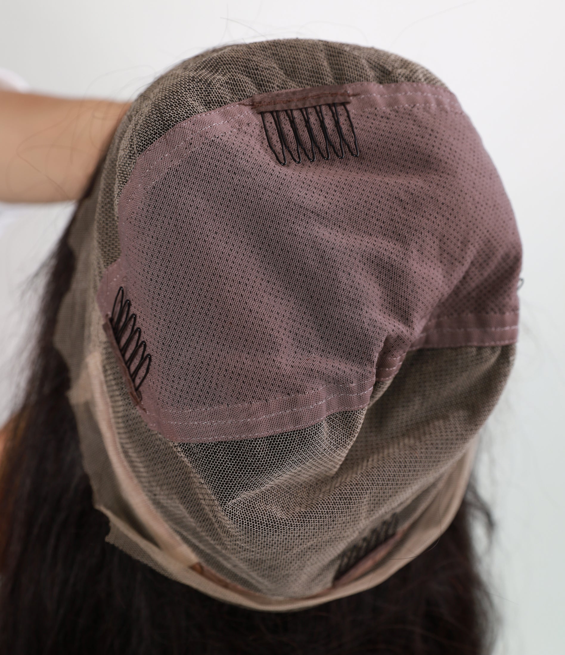 Genuine full lace wig in brunette brown by InTheMask, 16-22 inch length, showcasing natural hair texture and lace cap design.