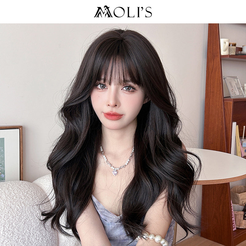 Long wavy black wig with airy flush bang, 62cm, by Inthemask by Moli's, featuring shiny, flowing hair and layered style.