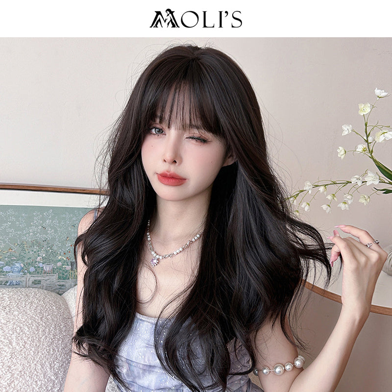 Long wavy black wig with airy flush bangs, 62cm, by Inthemask by Moli's, displayed on a mannequin head.