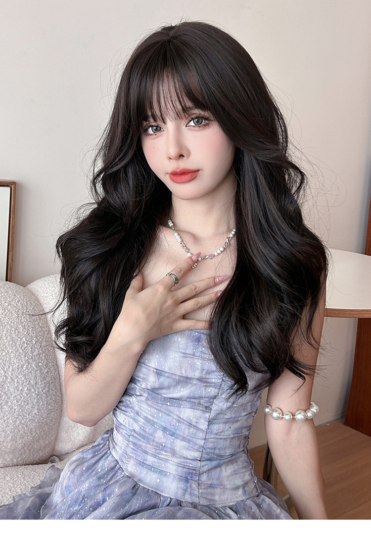Long wavy black wig with airy flush bangs, 62cm, by Inthemask by Moli's, showcasing flowing hair and stylish layered waves.