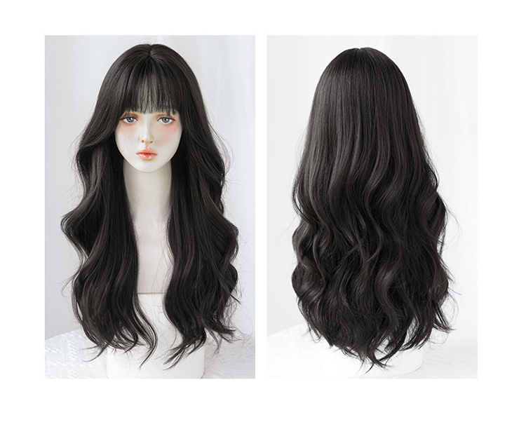 Long wavy black wig by Inthemask with airy flush bang, 62cm, featuring natural volume and soft, flowing waves.