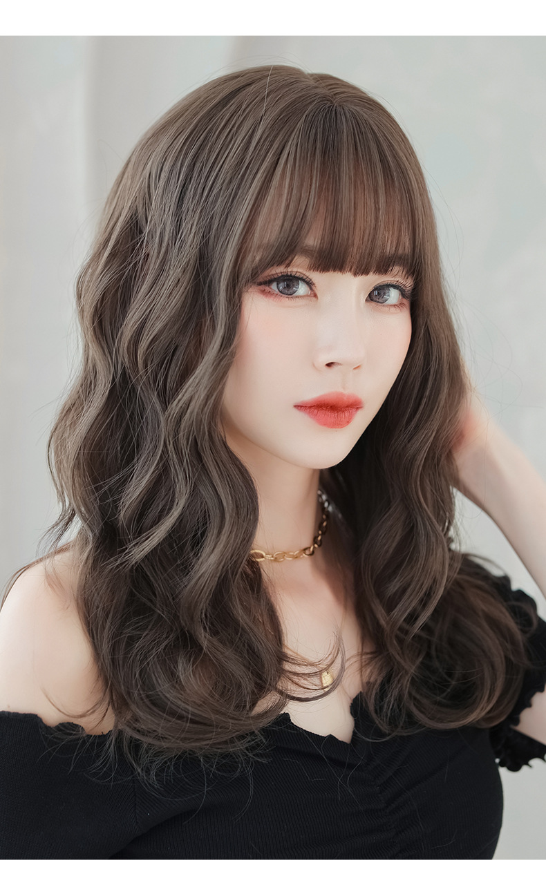 Brown straight wig with 52cm length and flush bangs from InTheMask by MOLIS, styled with sleek, natural-looking hair.