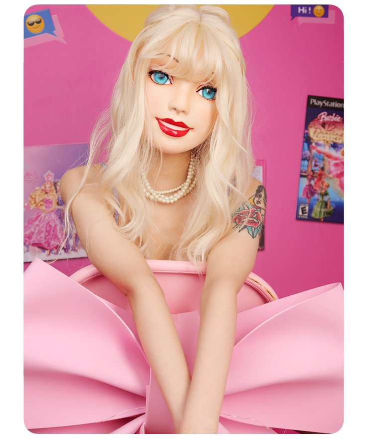 Pink latex doll mask with gag and hood from NEOGAN Queena collection by InTheMask, featuring realistic female features and detailed design.