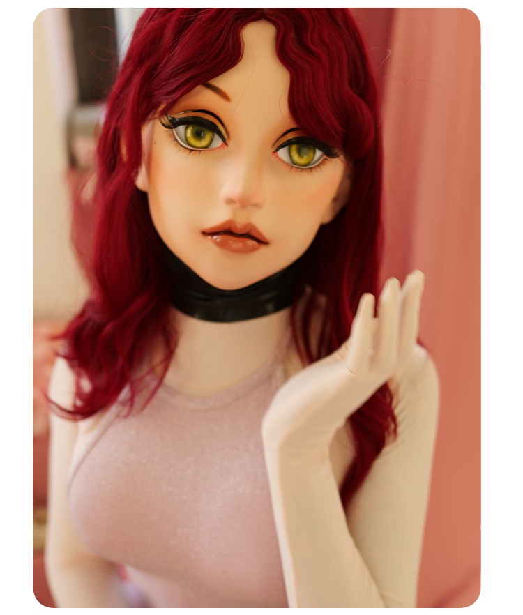 Pink latex female doll mask by Molis D04 with gag and hood, featuring almond eye design, part of the Inthemask by Moli's collection.