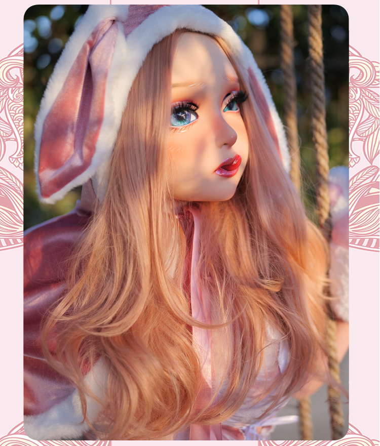 Inthemask by Moli's NEOGAN Cherrie female doll mask with latex hood and gag, pink latex, detailed face, and realistic features.